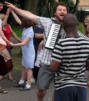 Children and adults play in the school
playground