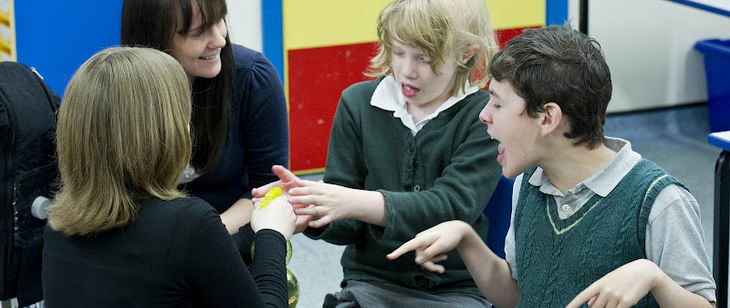 Positive behaviour in the classroom:
                  Two students and two teachers