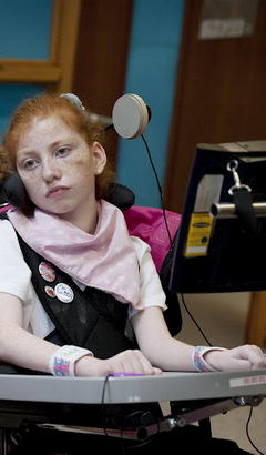 A girl uses a head movement control
system with her teacher