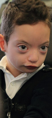 a boy in a chair
