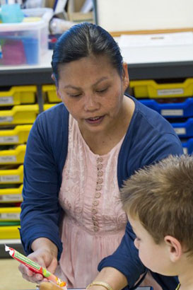 Girl and boy playing with picture cards