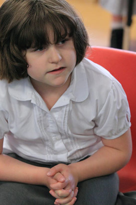 A girl sitting down