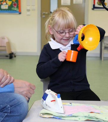 Girl and carer with cards