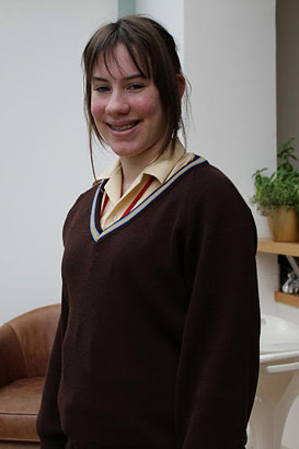 Girl standing smiling at camera