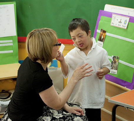 A boy and his teacher identify
                  Who is here today.