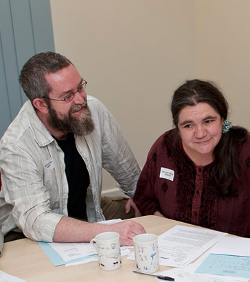 A practitioner and a parent at
a review meeting