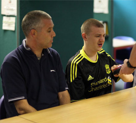 Boy smiling at a carer