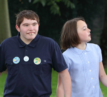 Boy in wheelchair participating in group
                  activity