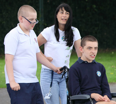 Boy in wheelchair participating in group
activity