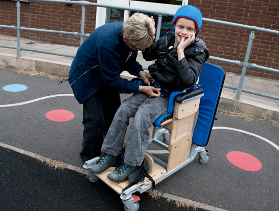 Smiling boy with carer