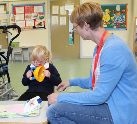 Girl and carer with cards