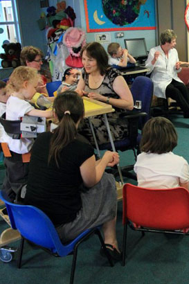Adults and children participating in a
                  call and response group