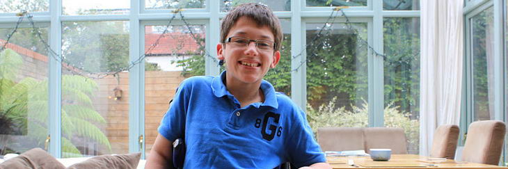 Boy in wheelchair smiling