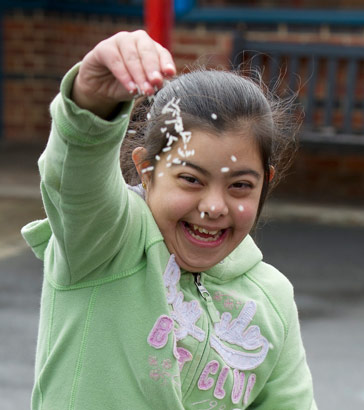 a girl throwing some confetti