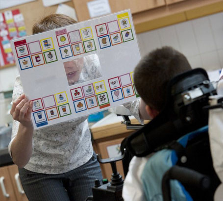 Teacher listens to child