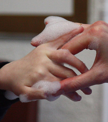 two hands touching at the centre of the
image