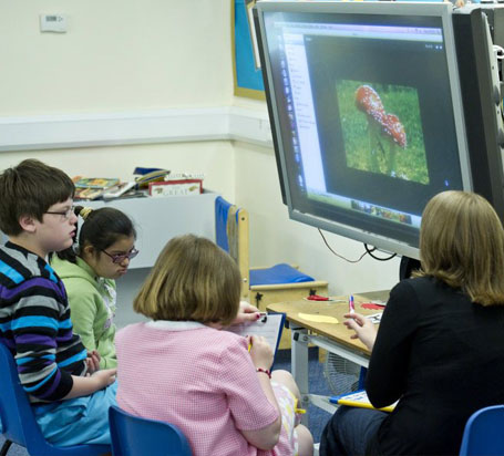 Teacher and children in a classroom