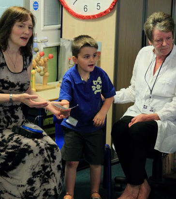 Boy with two carers