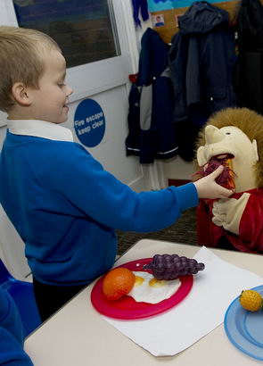 A boy, his teacher and a puppet