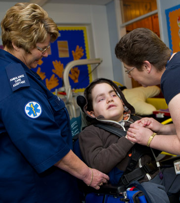 Matthew with two carers