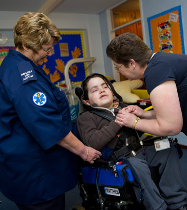 Mathew with two carers