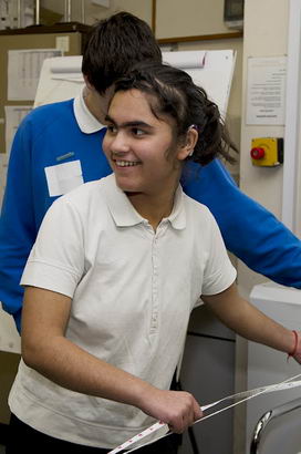 A girl participates in a science
                  experiment