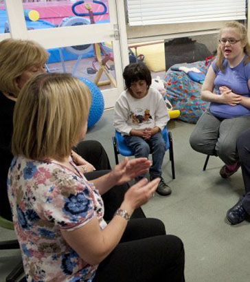 Teacher interacting with a boy