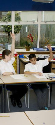 A boy raising his hand