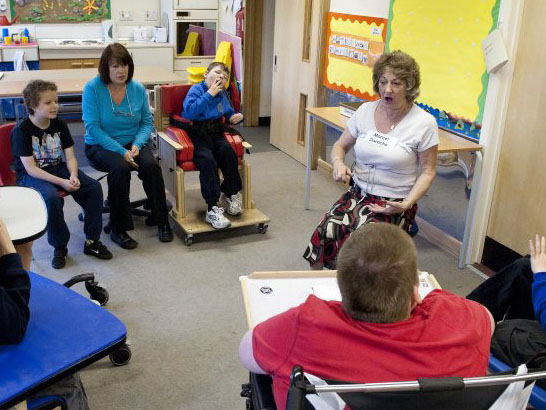 Teacher showing a card