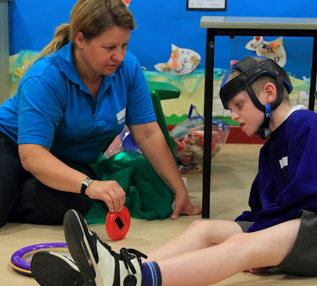 Teacher interacting with a boy