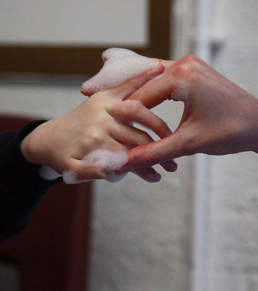 teacher holding a childs hand