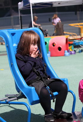 Two girls on play equipment