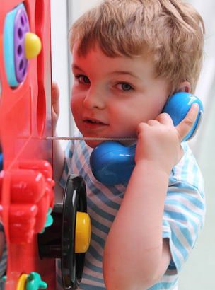 A young boy uses multi-sensory equipment