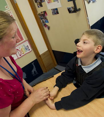 Adult with wheelchair pupil