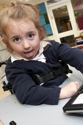 A girl uses a tech talk device