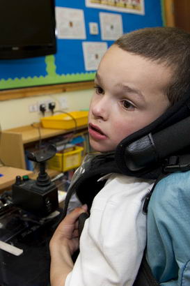 A boy uses some ICT equipment