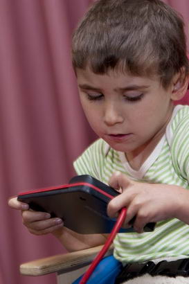 A boy using assistive technology