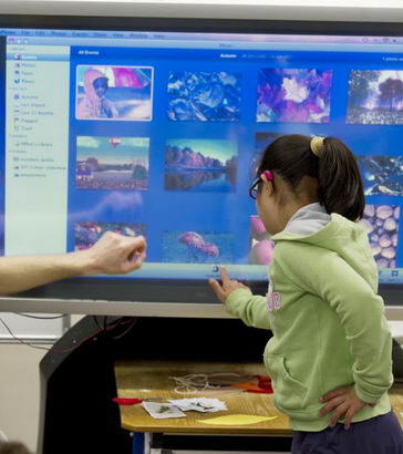 A girl uses a touchscreen