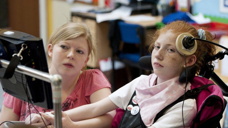 A girl in specialist chair
and her teacher