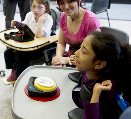 Two teachers and two pupils interact
                  in a positive and engaging way