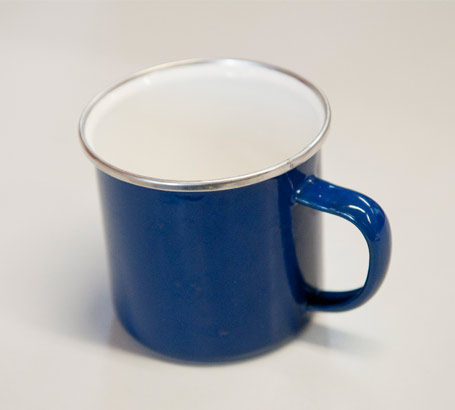 A blue mug photographed on its
own and used as an object of reference