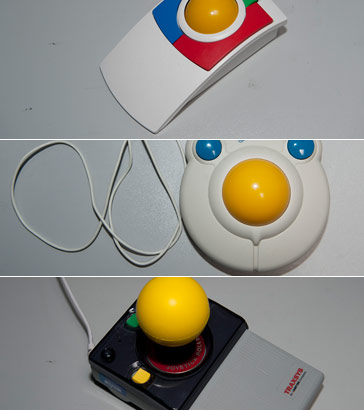 Articulated clamp holding
large red button in front of computer monitor