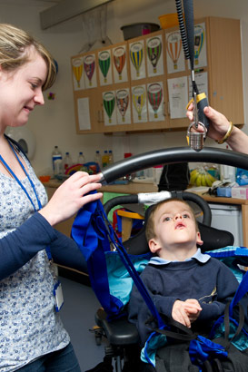 Harry being hoisted into wheelchair