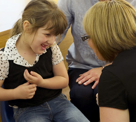 Teacher and girl in class