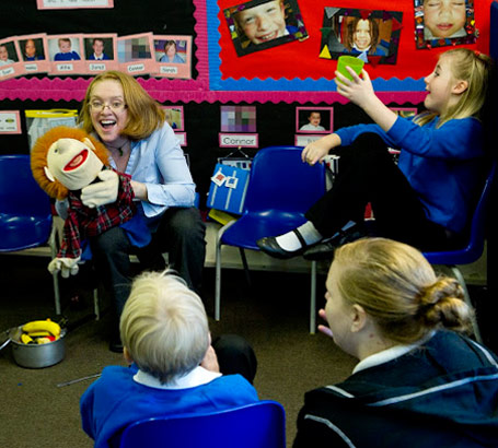 Teacher with puppet in class