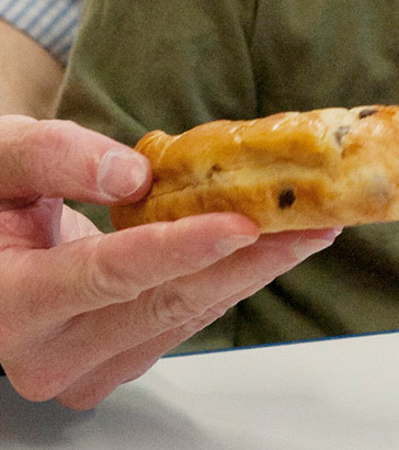 Male teacher helping boy to choose
                  his lunch