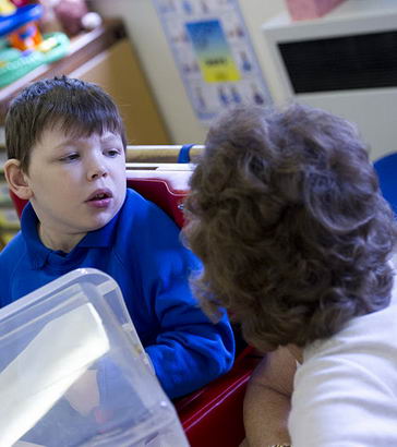 A boy with his teacher