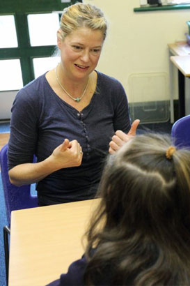 Boy sitting down with carer