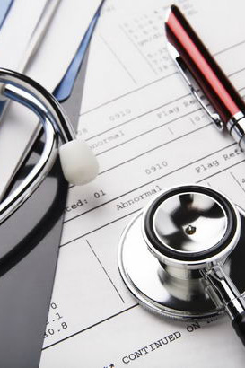 A stethoscope, pen and diagnostic
document
