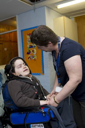 Boy in wheelchair with two teaching
assistants/nurses